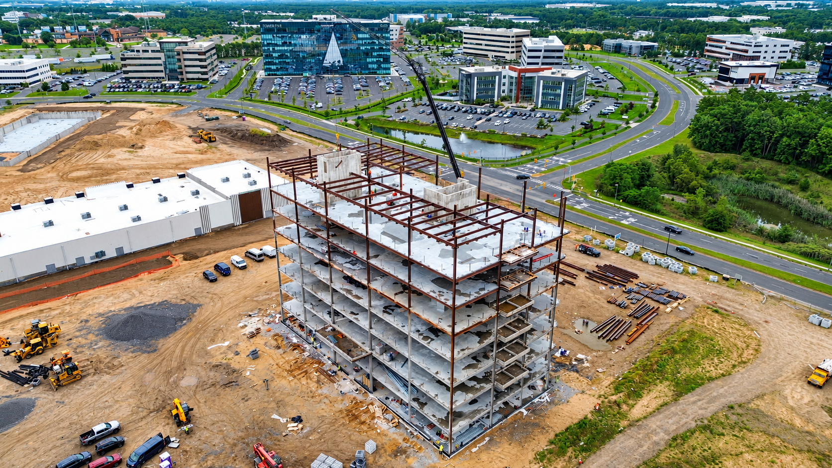 Aerial view of Spire One under construction with Tower Five visible in the background