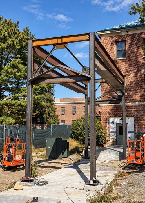 Veterans Affairs Medical Center steel frame erection alongside existing brick structure, Montrose, New York